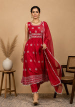 SN120 women’s red embroidered kurta set walking pose with flowing dupatta and flared silhouette