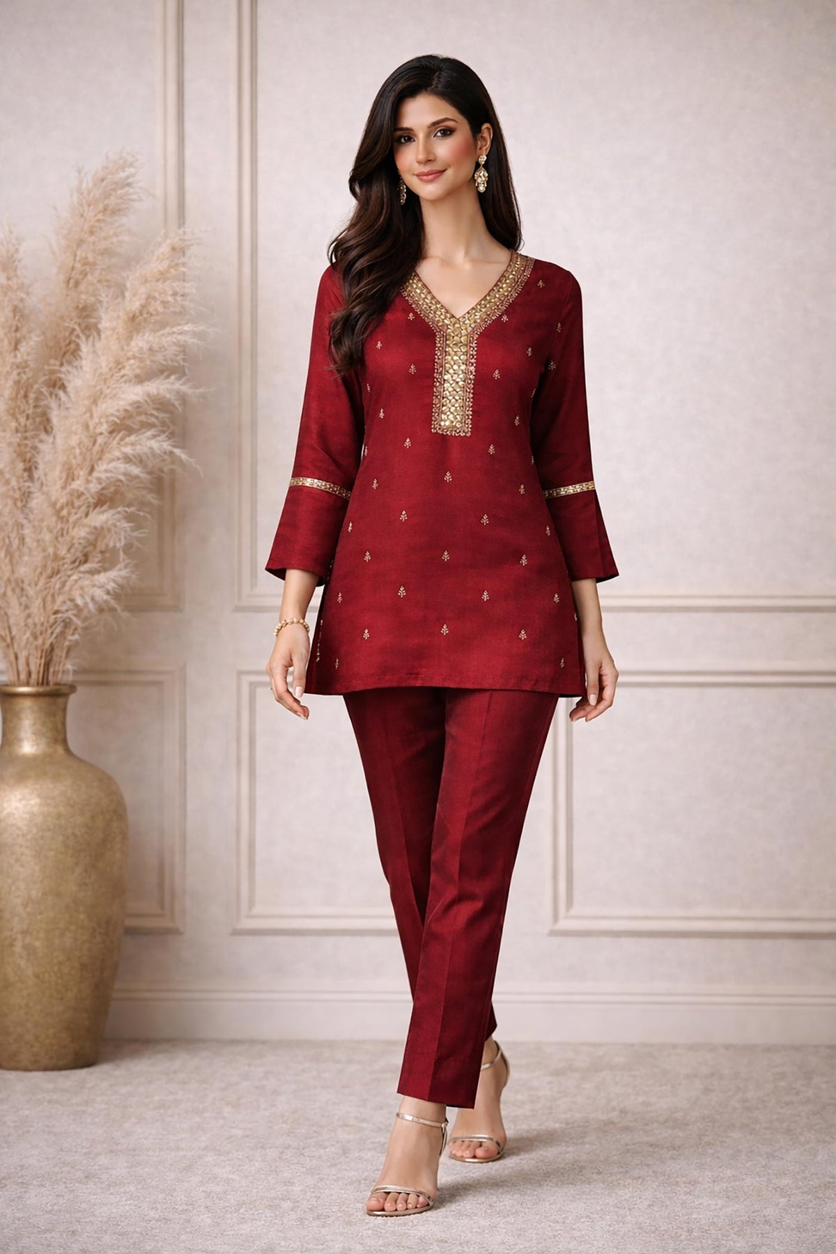 SN147 women’s maroon embroidered kurta set walking pose with straight trousers and elegant festive styling