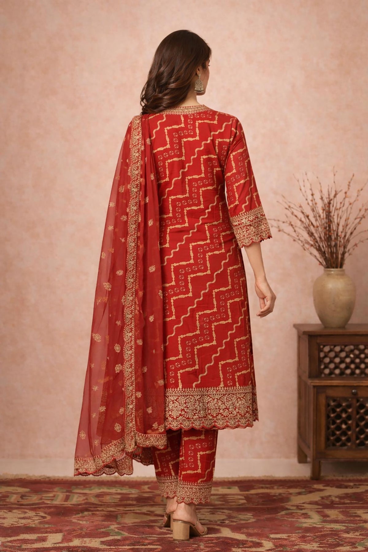 SN150 women’s vermilion red Bandhani cotton silk kurta set back view with gold print and dupatta.