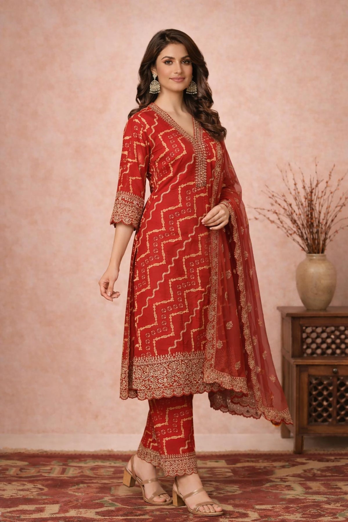 SN150 women’s vermilion red Bandhani cotton silk V-neck kurta set side pose with flowing dupatta.