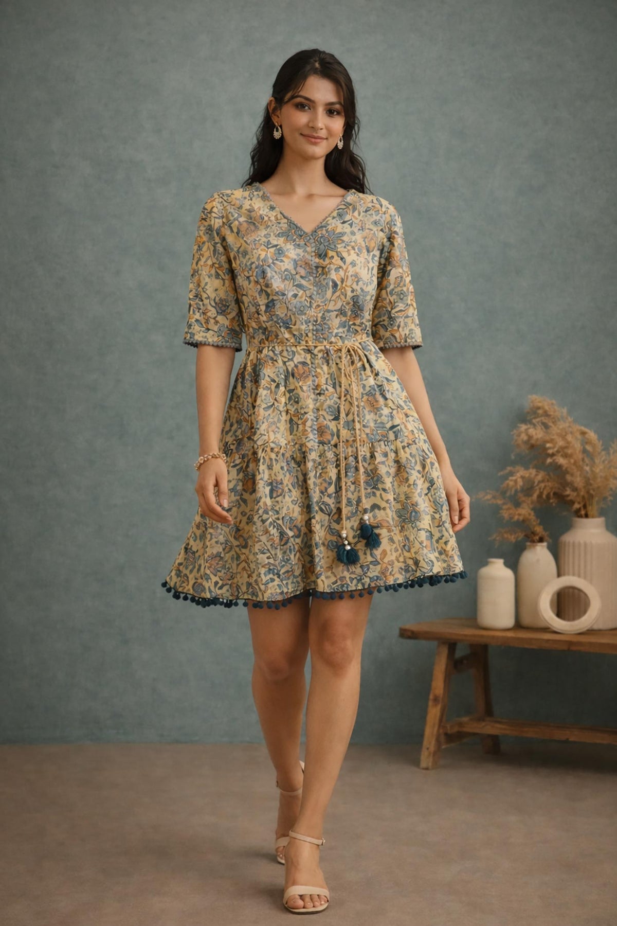 SN159 women’s butter yellow floral cotton tiered dress walking pose with flowy silhouette