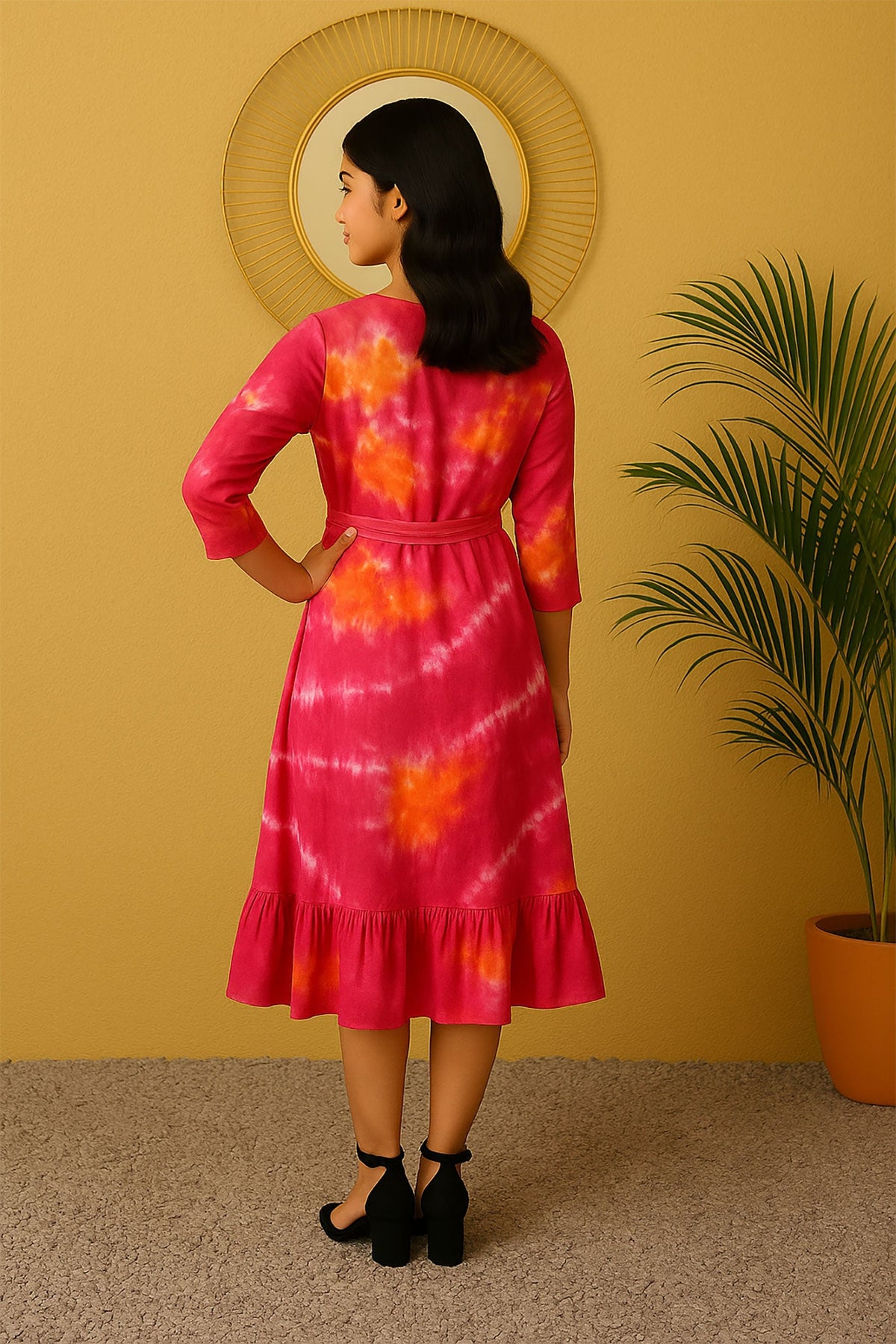 Back view of women’s pink orange tie-dye rayon midi dress with waist belt