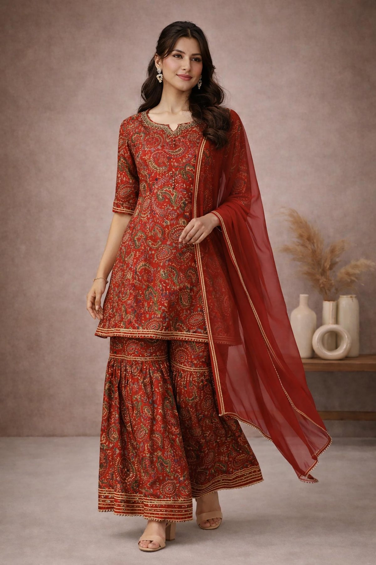 SN162 women’s red cotton silk kurta sharara set with V-neck and flowing dupatta walking pose.