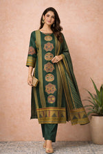 SN163 women’s forest green silk blend kurta set walking pose with striped dupatta and straight pants