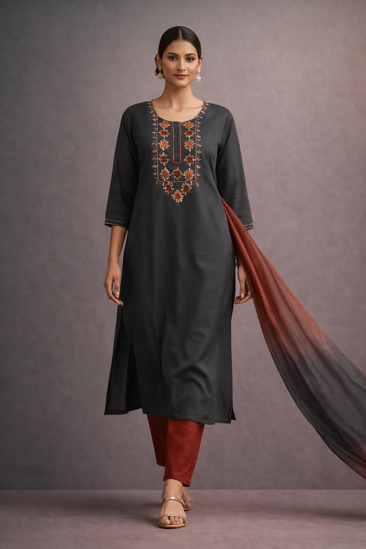 SN167 women’s charcoal grey embroidered kurta set walking pose with rust pants and ombre dupatta