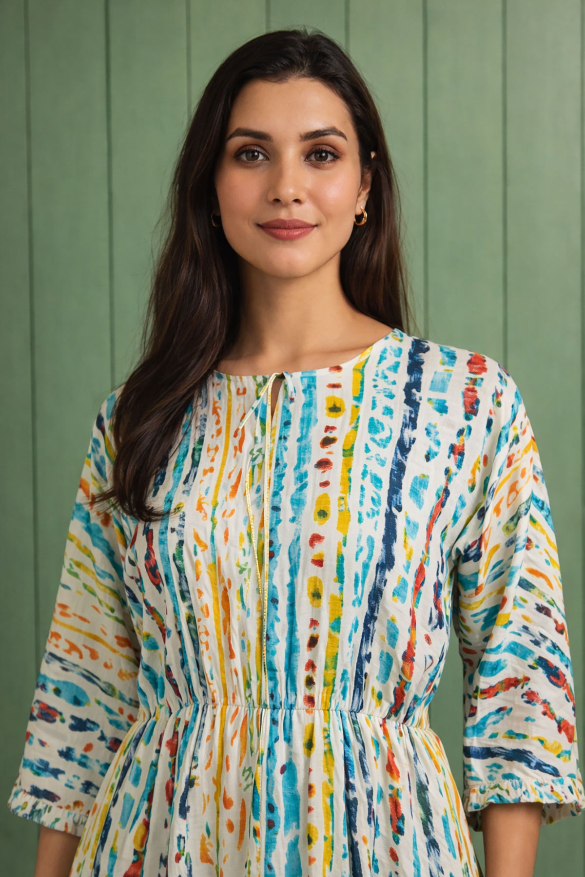 Closeup of women’s multicolor cotton midi dress showing print and neckline detail