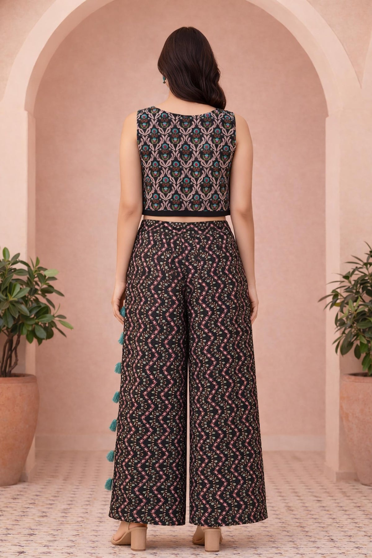 Black printed crop top and palazzo set, back view, floral vine motifs, wide-leg pants.