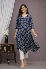 SN176 women’s navy blue geometric cotton asymmetric dress walking pose with flowy hem and V-neck detail.