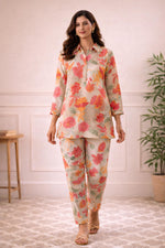 SN181 women’s ivory floral kurta co-ord set with three-quarter sleeves styled with flats walking pose