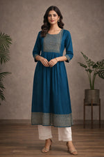 SN183 women’s teal blue embroidered cotton kurti, round neck, three-quarter sleeves, front pose with flared silhouette