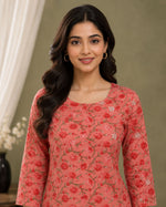 SN185 women’s coral floral cotton kurti closeup showing round neckline and three-quarter sleeves