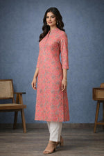 SN197 women’s coral pink floral cotton kurti with straight fit and side slits, side view.