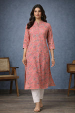 SN197 women’s coral pink floral cotton kurti with mandarin neckline and straight silhouette, walking pose.