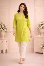SN249 women’s lime green cotton embroidered kurti walking pose with straight silhouette and slit neckline