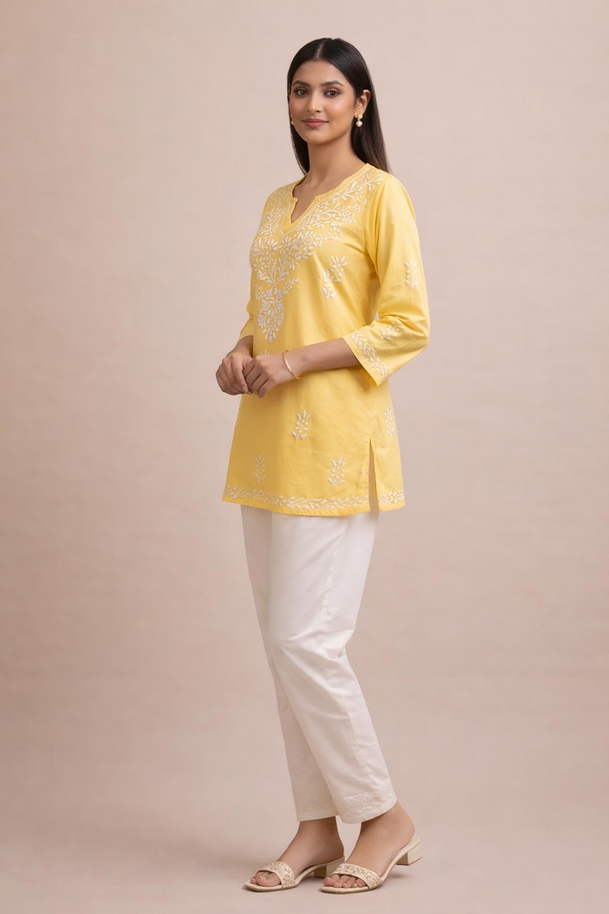 SN253 women’s butter yellow cotton chikankari kurti side pose with straight fit and three-quarter sleeves