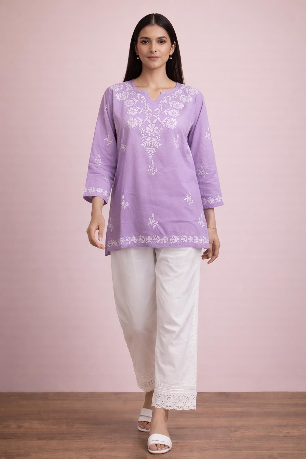SN254 women’s lavender cotton embroidered kurti walking pose with straight fit and floral embroidery.