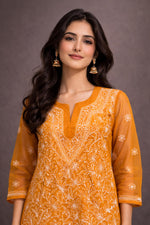SN257 women’s mustard georgette chikankari kurti closeup showing V-neckline and detailed white embroidery