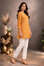 SN257 women’s mustard georgette chikankari kurti side pose with sheer sleeves and relaxed A-line fit