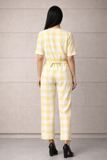 SN26 women’s pastel yellow gingham cotton jumpsuit back pose showing rear fit and design
