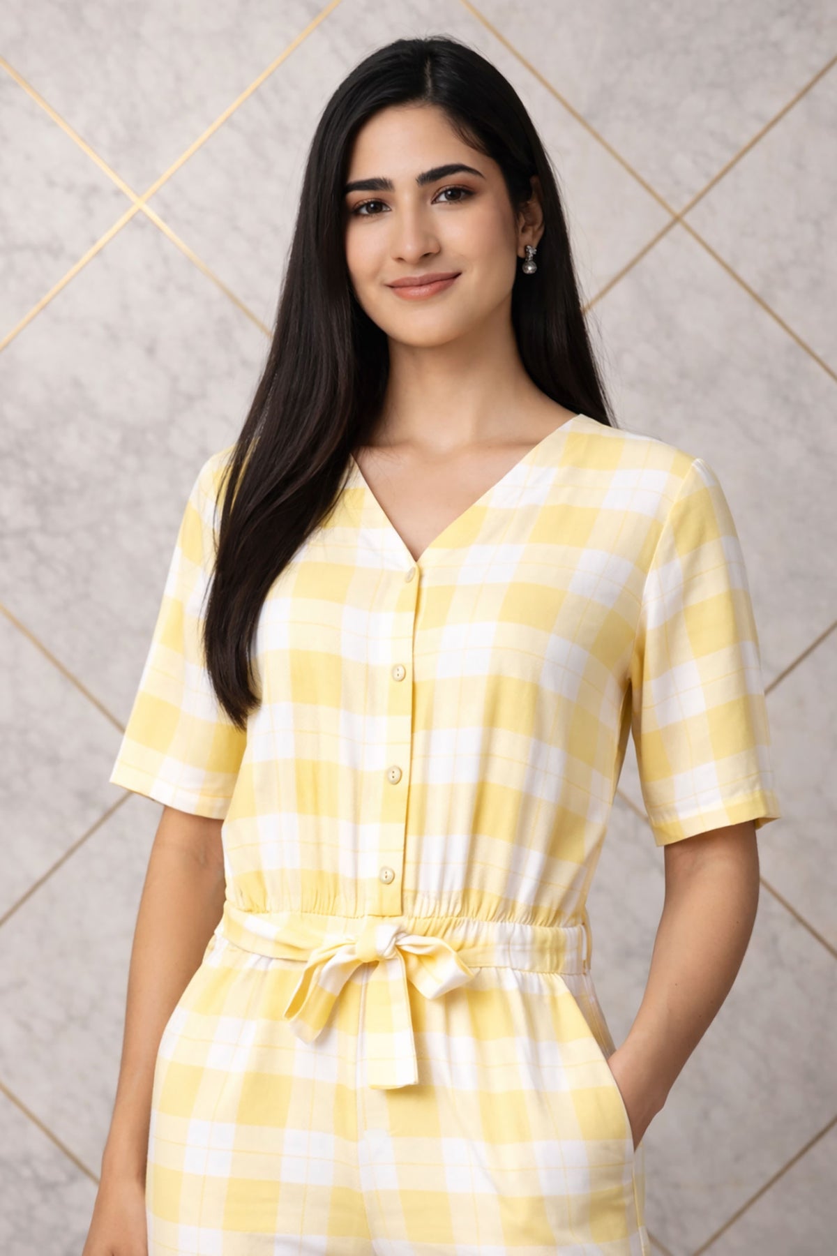 SN26 women’s pastel yellow gingham cotton jumpsuit V-neck detail closeup pose