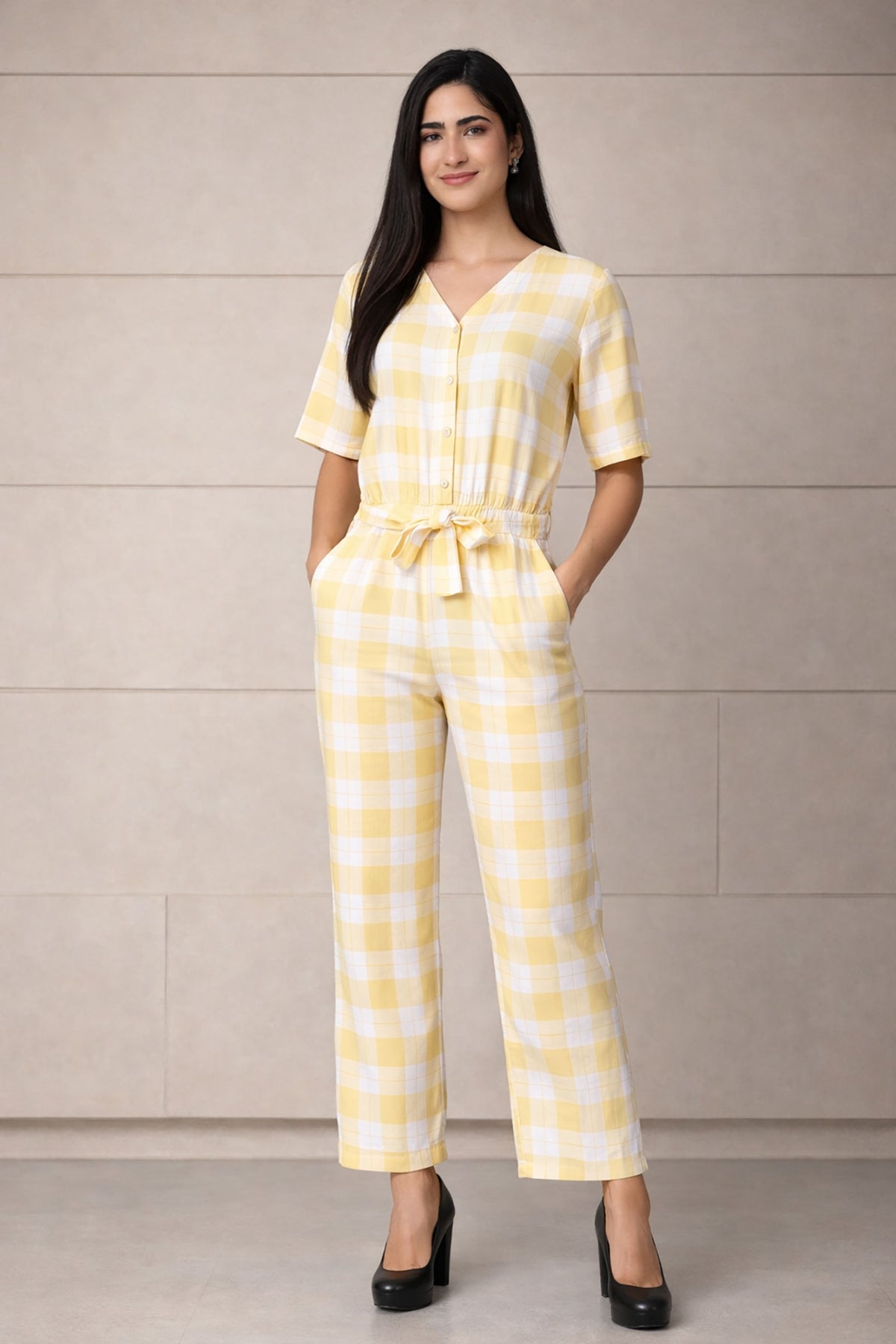 SN26 women’s pastel yellow gingham cotton jumpsuit with V-neck and short sleeves front pose