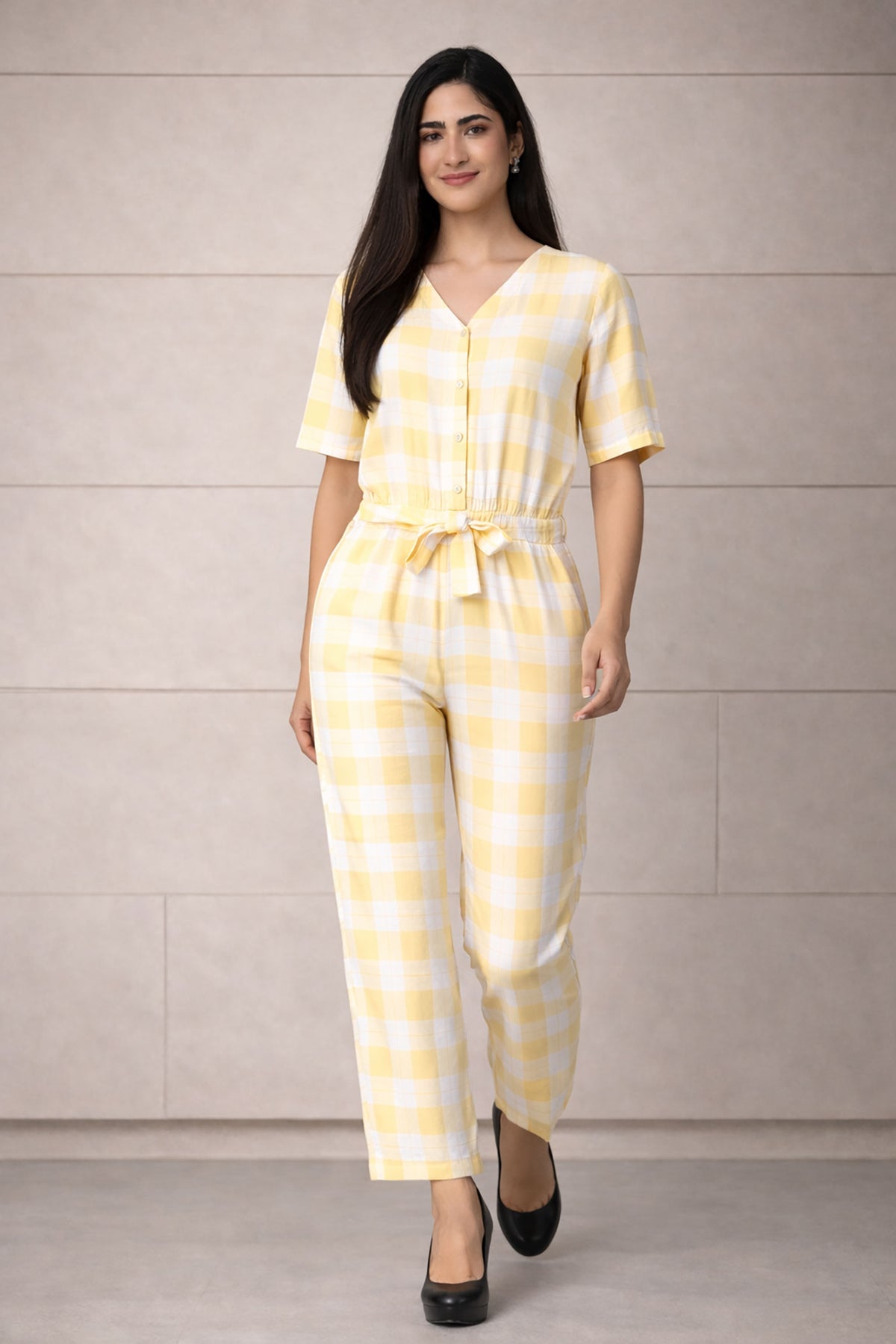SN26 women’s pastel yellow gingham cotton jumpsuit walking pose with natural fabric movement