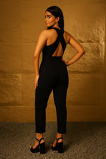 SN29 women’s black halter neck jumpsuit with open crisscross back and tailored fit, back pose