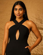 SN29 women’s black halter neck jumpsuit featuring crisscross neckline and front keyhole detail, closeup pose