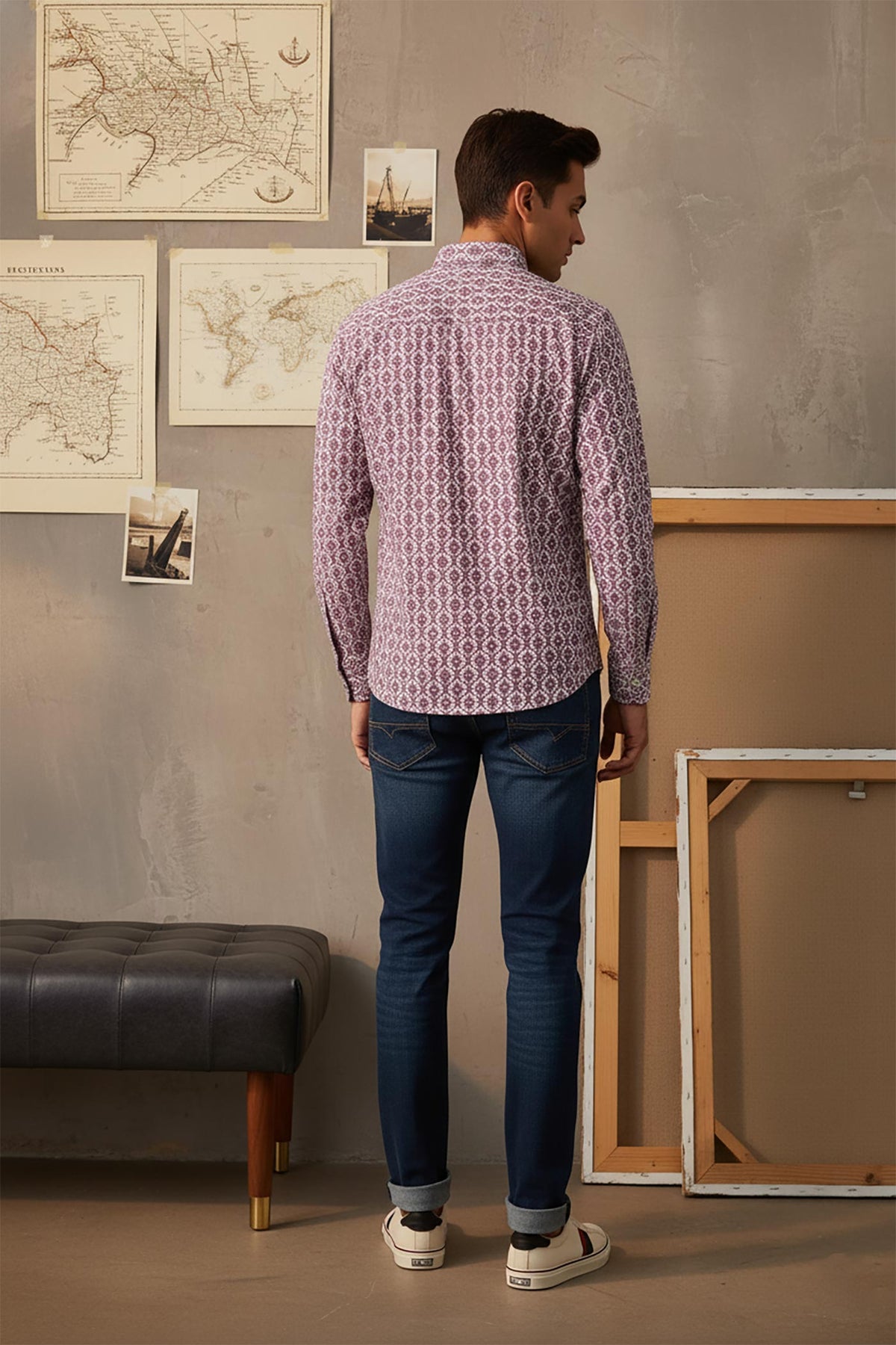 Back view of purple printed cotton shirt with geometric pattern, slim silhouette paired with dark blue jeans.