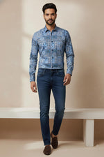 SN323 blue cotton blend mosaic print slim fit men’s shirt walking pose with loafers and dark jeans