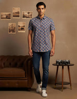 SN326 men’s slate blue cotton floral print short sleeve shirt walking pose with rolled denim styling
