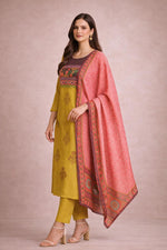 Mustard yellow kurta set with contrast pink dupatta, side angle showing straight silhouette and prints