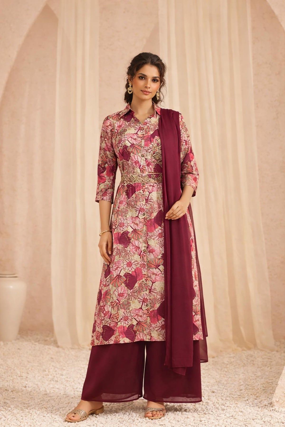 Maroon floral kurta set with palazzo and dupatta, front walking view with gold sandals.