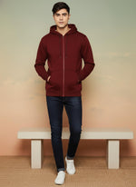 SN354 men’s maroon cotton fleece zip-up hoodie with hood and ribbed cuffs, walking pose styled with dark jeans