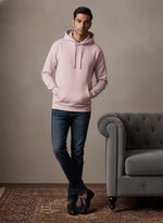 SN361 men’s soft pink cotton fleece hoodie with long sleeves and kangaroo pocket, front pose styled with jeans and loafers