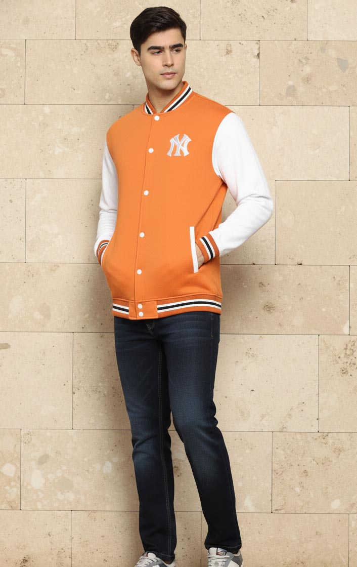 SN364 men’s orange cotton blend varsity jacket with striped cuffs and long sleeves, side pose view.