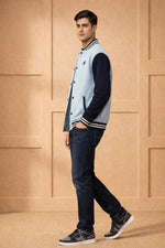 SN366 men's powder blue varsity bomber jacket with navy sleeves, slim fit long sleeve, side pose view