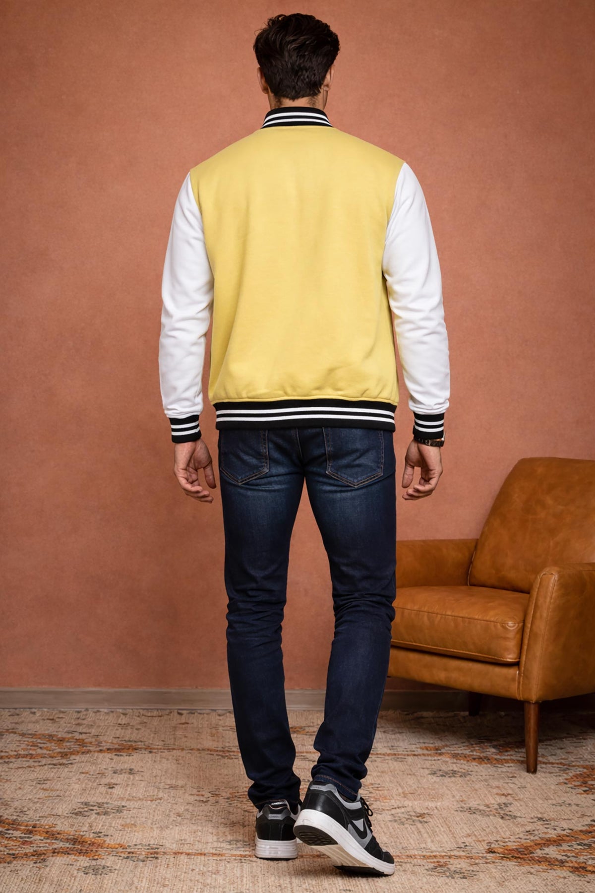 SN367 men’s pastel yellow varsity jacket back pose with ribbed hem and long contrast sleeves.