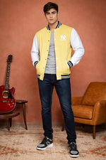 SN367 men’s pastel yellow cotton-blend varsity jacket with long sleeves and ribbed collar, front pose.