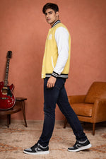 SN367 men’s pastel yellow cotton-blend varsity jacket with contrast sleeves, slim fit side pose.