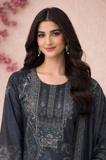 Close-up of charcoal kurta neckline with embroidery, lace detailing, and teal paisley motifs.