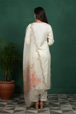 Ivory kurta set back view featuring scalloped dupatta border and floral print, straight silhouette with block heels.