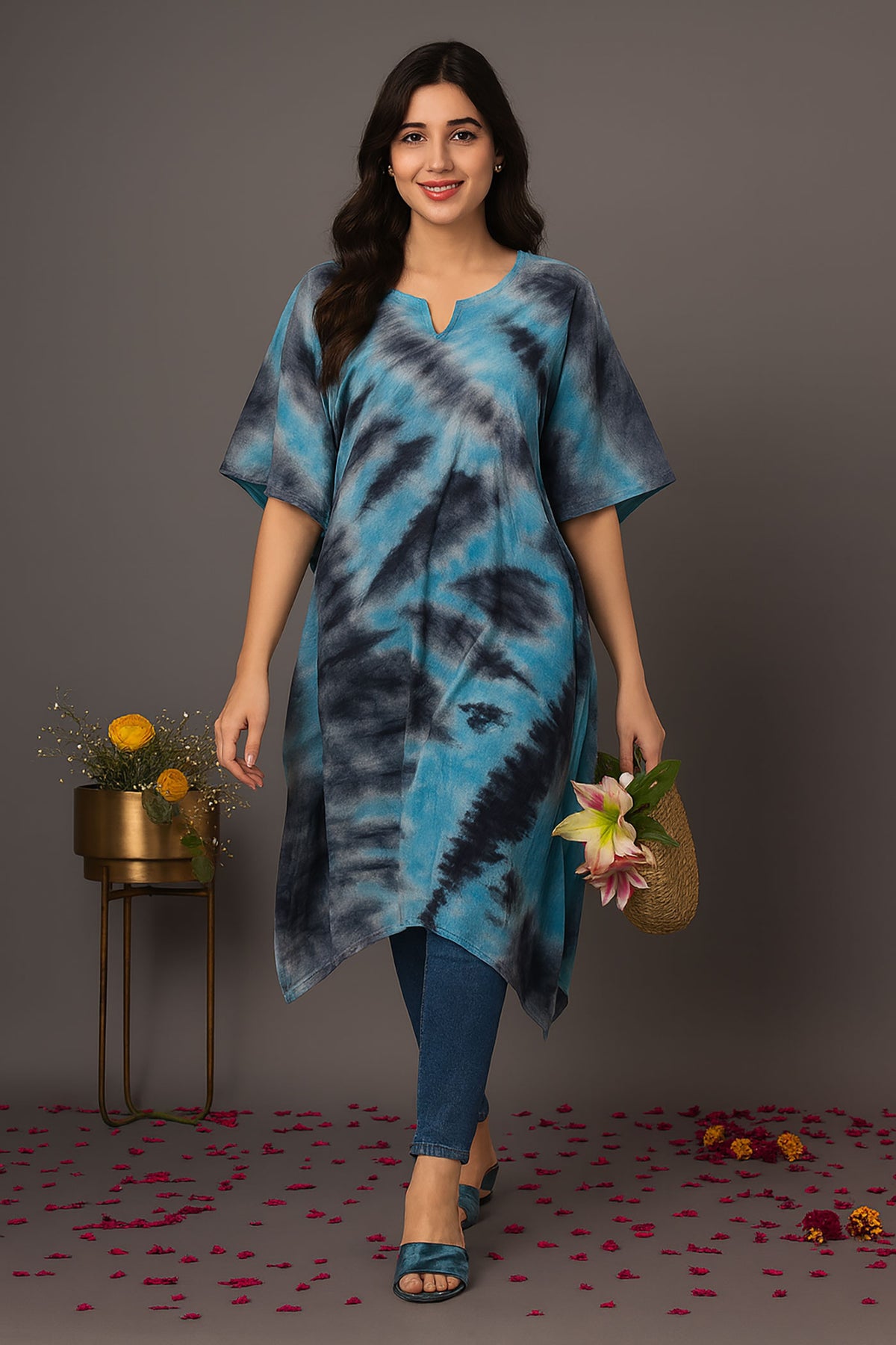 Front walking view of women’s blue and black tie-dye kaftan kurti with relaxed fit and asymmetrical hem, styled with jeans and flats for casual everyday wear