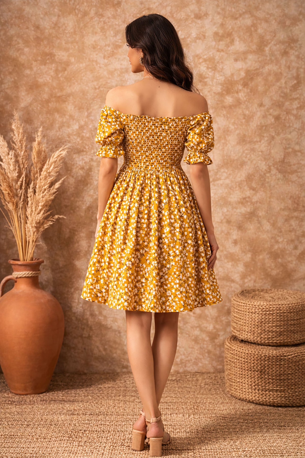 Back view of mustard floral off shoulder dress for women showing smocked bodice and fit and flare silhouette