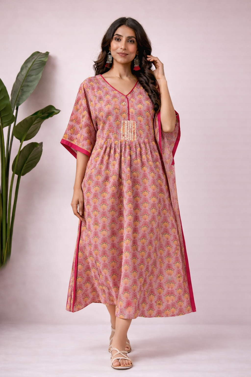Pink and mustard cotton kaftan kurti with handblock print, V-neckline, elbow sleeves and empire waist detail front view