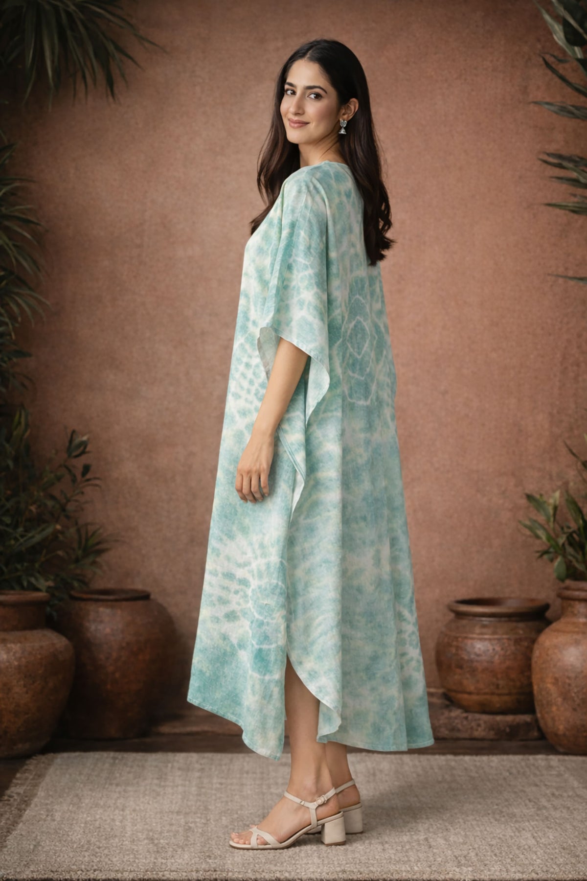 Side view of mint green tie dye kaftan dress showing flowy drape and relaxed fit
