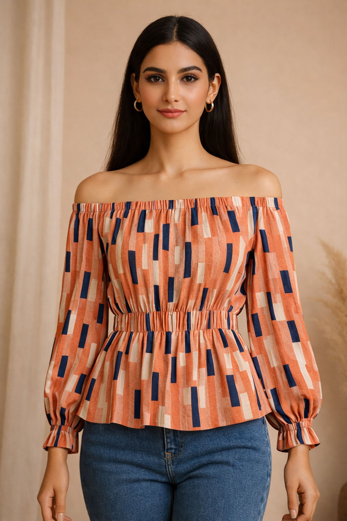 Woman wearing an off-shoulder top with a geometric pattern against a beige background
