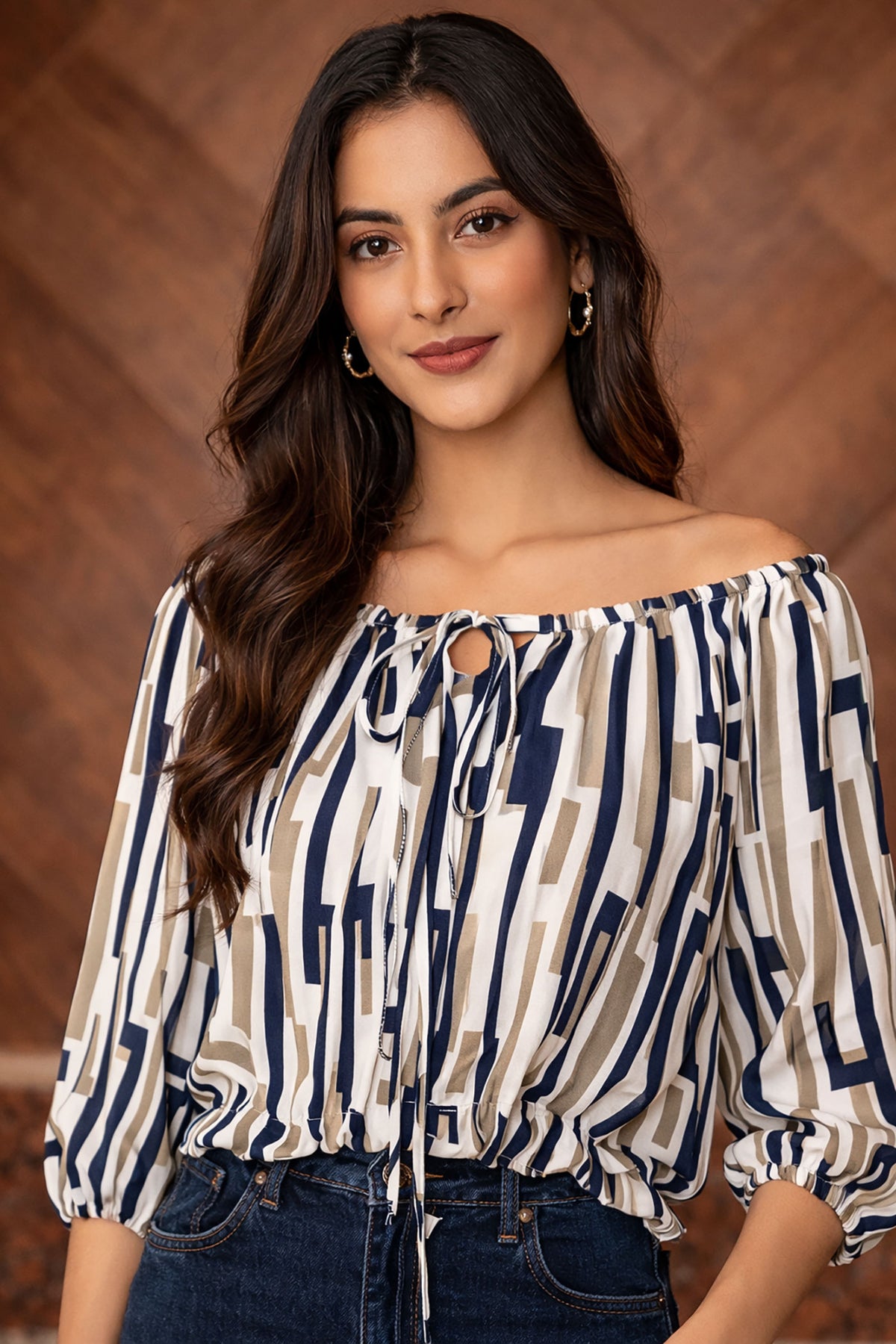 Woman wearing a patterned blouse with a wooden background
