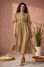 Women’s ethnic tribal printed midi dress in walking pose showing flowy A-line movement