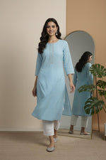 SN113 women’s sky blue cotton kurta pant set with round neck and lace pants walking pose